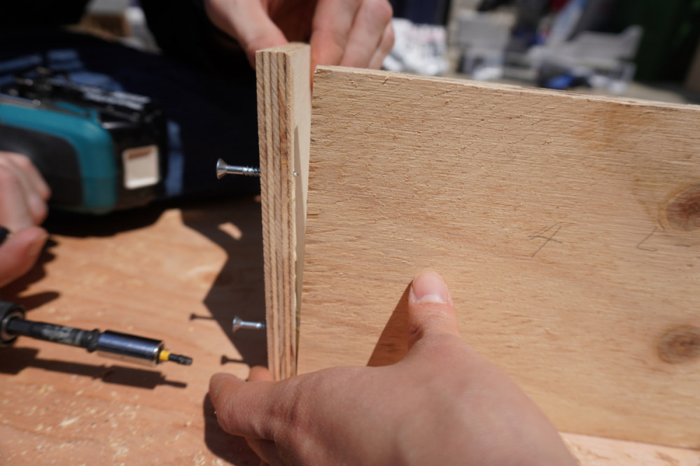 Attaching front and side panels together.