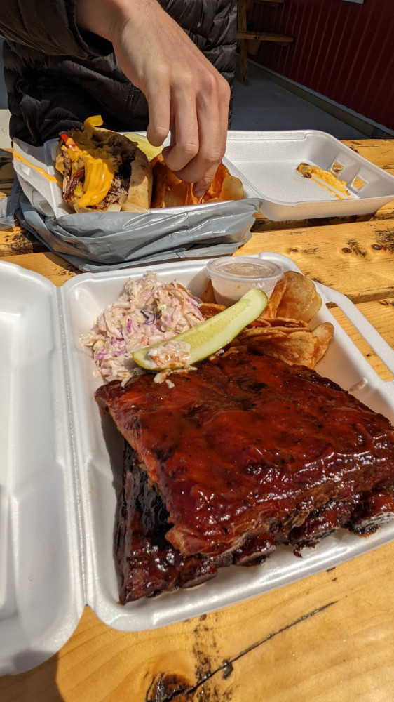 Lunch of BBQ ribs, coleslaw, and chips.